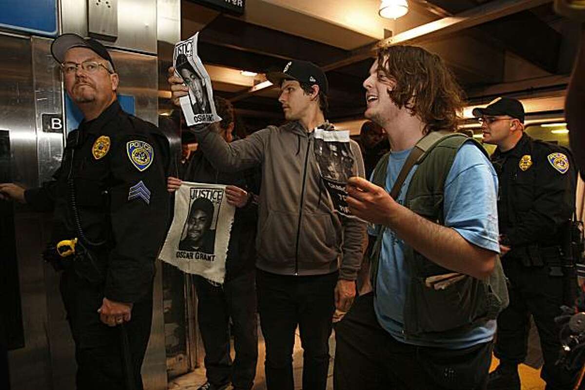 A group of about two dozen protest the Oscar Grant incident, as tactical police secure the passenger platform at the Bart station in the Embarcadero in San Francisco, Calif., on Thrusday, April 8, 2010.