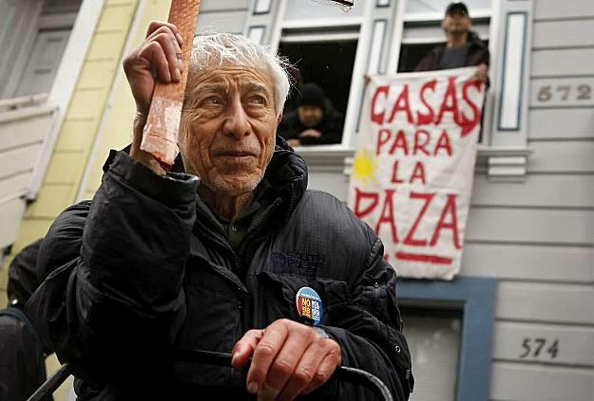 Jose Morales protests with a group called Homes Not Jails on Sunday outside what was once his home for 43 years until he was evicted in San Francisco.