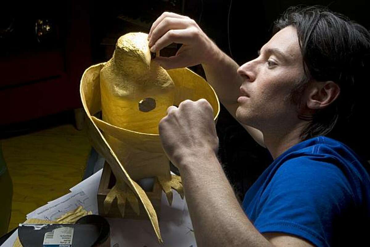 Film maker / musician / multimedia performance artist, Brent Bishop, works on a golden falcon he created in his studio at Million Fishes in San Francisco on Friday, April 2, 2010. The falcon will be a prop in a group performance by the on Saturday night, April 3. Kat Wade / Special to the Chronicle