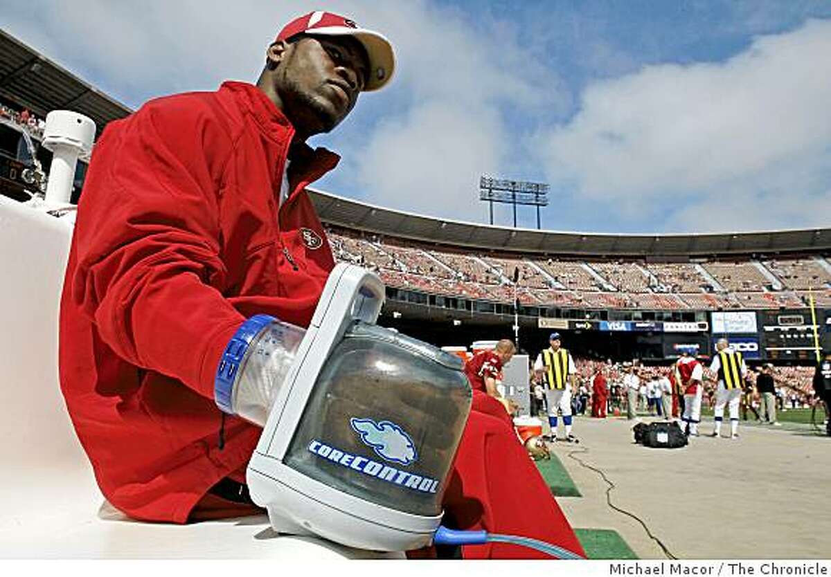 San Francisco 49er, Marcus Hudson, demonstrates the RTX Rapid Thermal Exchanger which is used on the sidelines during football games the cramping of the muscles of players as well as lowering the core temperatures of overheated athletes, at Candlestick Park in San Francisco, Calif. on Sunday Sept. 21, 2008.