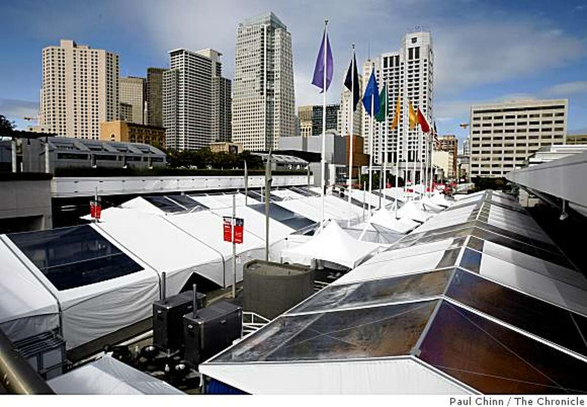 Tents are erected on a one-block stretch of Howard Street in front of the Moscone Convention Center for the week-long Oracle OpenWorld conference in San Francisco, Calif., on Friday, Sept. 19, 2008.