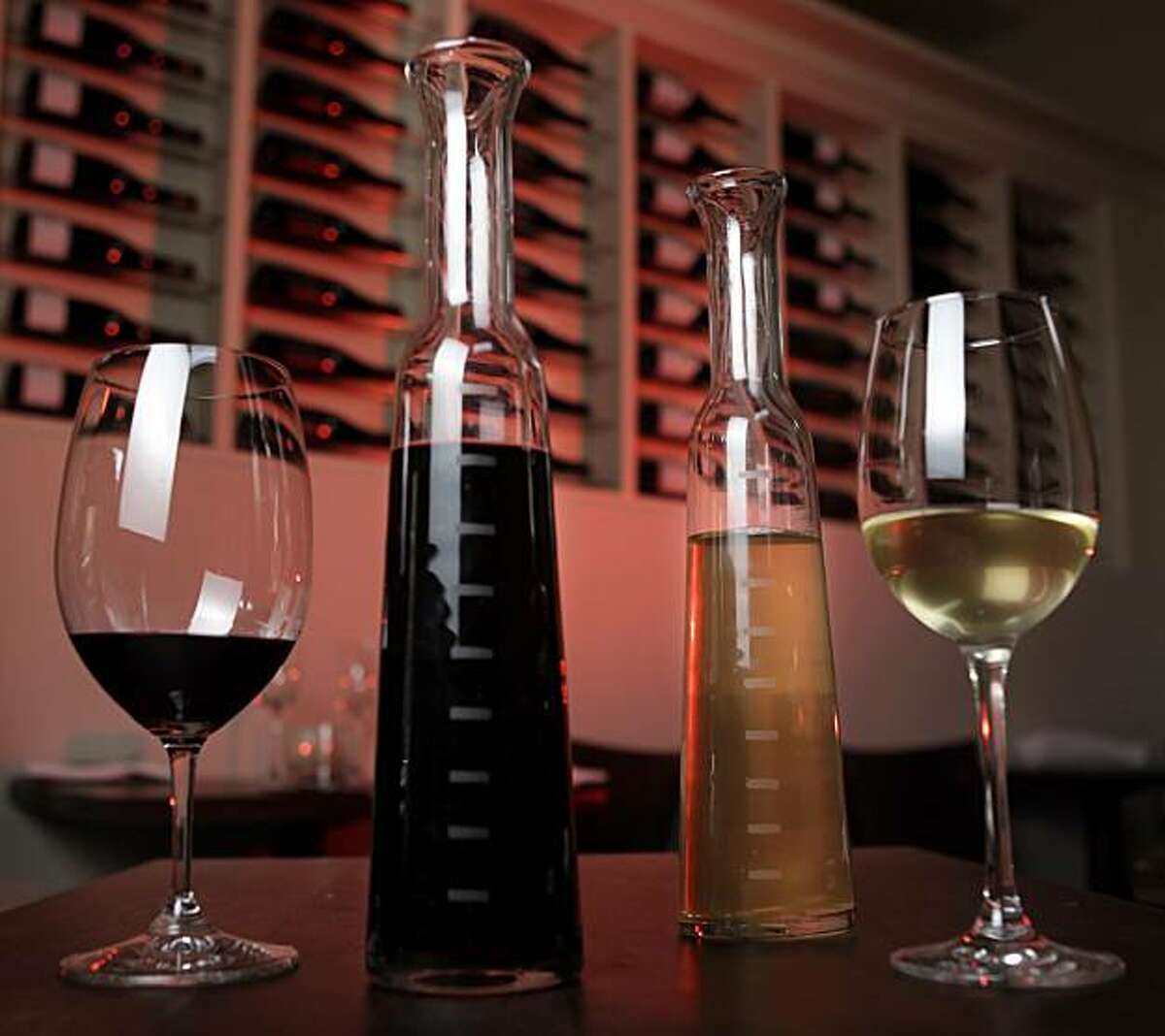 A bottle of red and white blend wine are what is served as the house wines on tap at Frances restaurant, March 28, 2010, in San Francisco, Calif. The bottles are marked every two ounces and are charged one dollar an ounce.