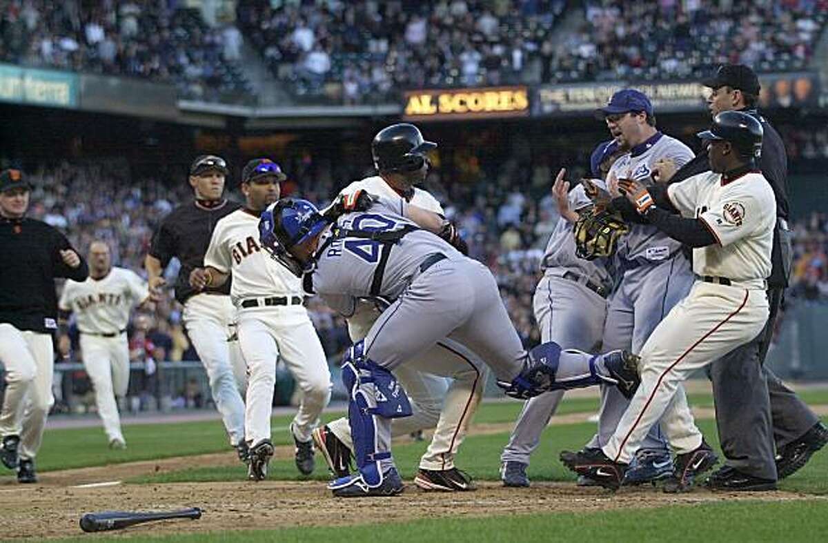 Los Angeles Dodgers reliever Eric Gagne, third from right, is held by teammate Adrian Beltre and San Francisco Giants' Ray Durham as Dodgers catcher Paul LoDuca holds San Francisco Giants' Michael Tucker in the ninth inning on Thursday, June 24, 2004, in San Francisco. Tucker rushed the mound after being knocked down by a pitch from Gagne causing a bench-clearing brawl. Giants won, 9-3. This photo is included in "Giants Past & Present" by Dan Fost, published in 2010 by MVP Books.