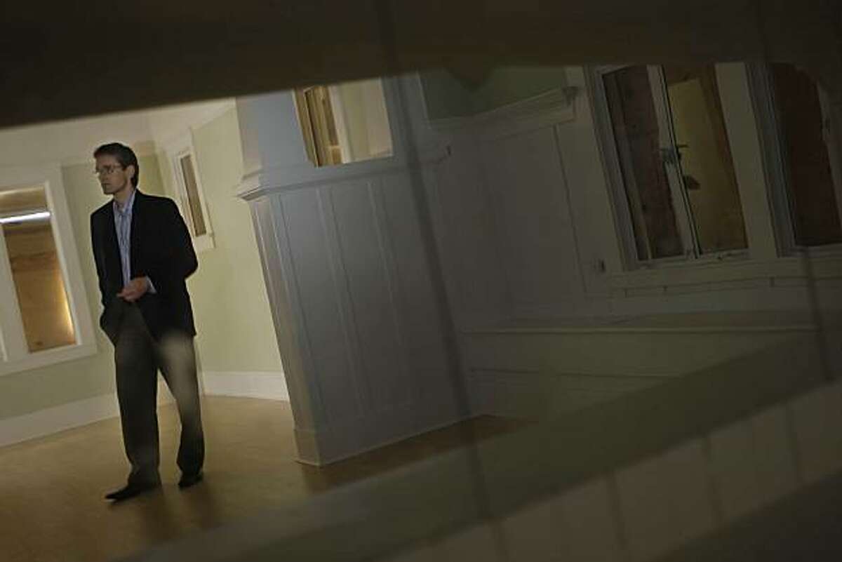 Realtor John Robin stands in a home that he helped investors buy and sell in Richmond, Calif. on Wednesday, March 24, 2010.