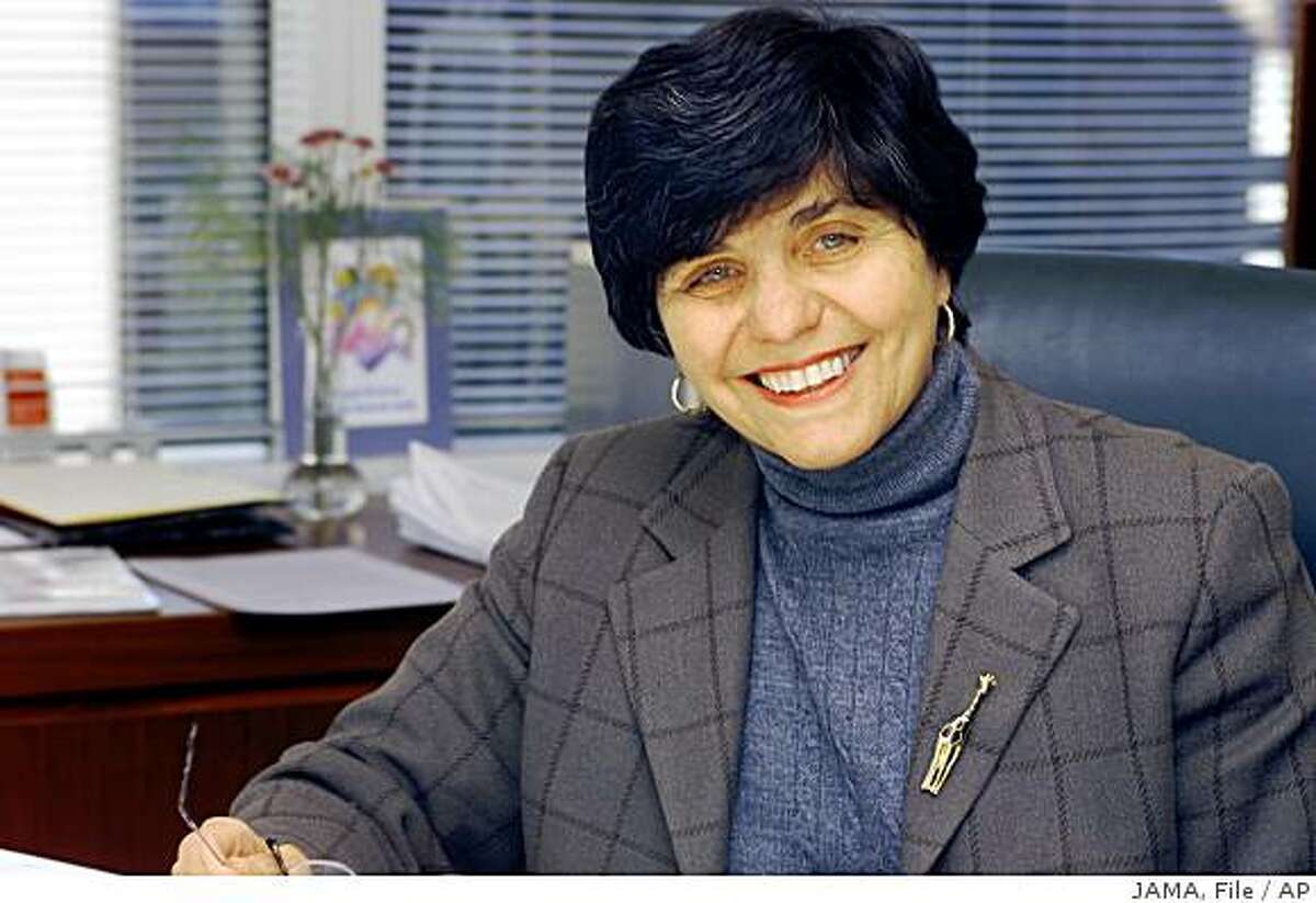 **FILE** In this undated file photo, Journal of the American Medical Association editor-in-chief Dr. Catherine D. DeAngelis is seen in her office in Chicago, Ill. In a challenge unthinkable even two months ago, Dr. DeAngelis now compares the drug safety system to a dangerous building: "This building is on very shaky ground. Would I condemn it? No, but I would tell people, You go in at your own risk." (AP Photo/JAMA, file) **NO SALES**