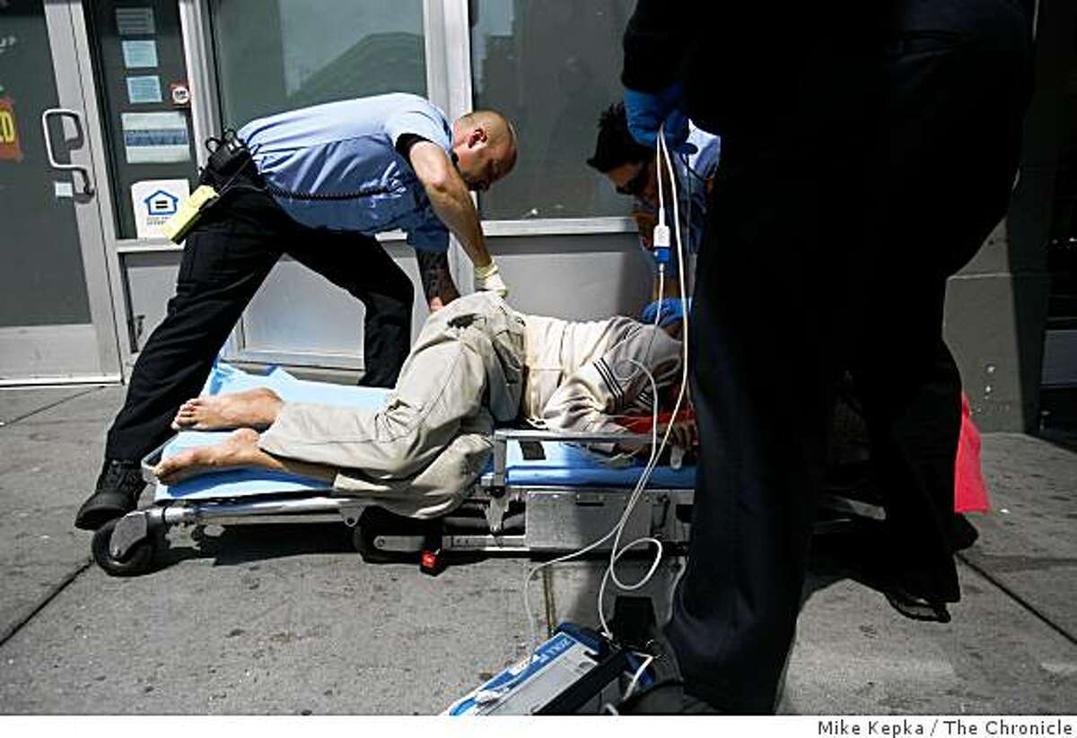 A team of dynamically deployed paramedics with the San Francisco Fire Department respond to collapsed patient in the Tenderloin district of San Francisco on Friday May 18, 2007 in San Francisco Calif.