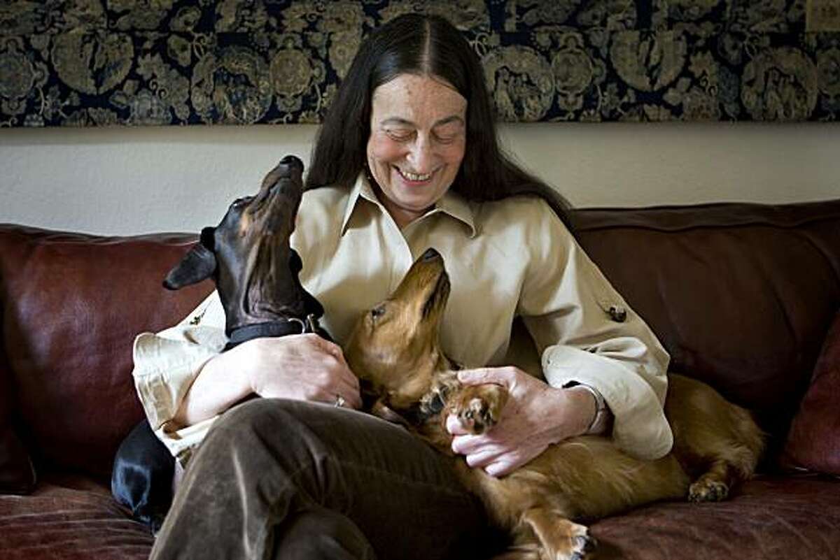Carol Shloss and her two dachshunds, Cary and Sophie, pose for a portrait on her couch in Stanford, Calif. on Friday, Feb. 5, 2010. Despite recently winning a large settlement against the estate of James Joyce, the Stanford University English professor, eager to move on, is currently working on an Ezra Pound biography.