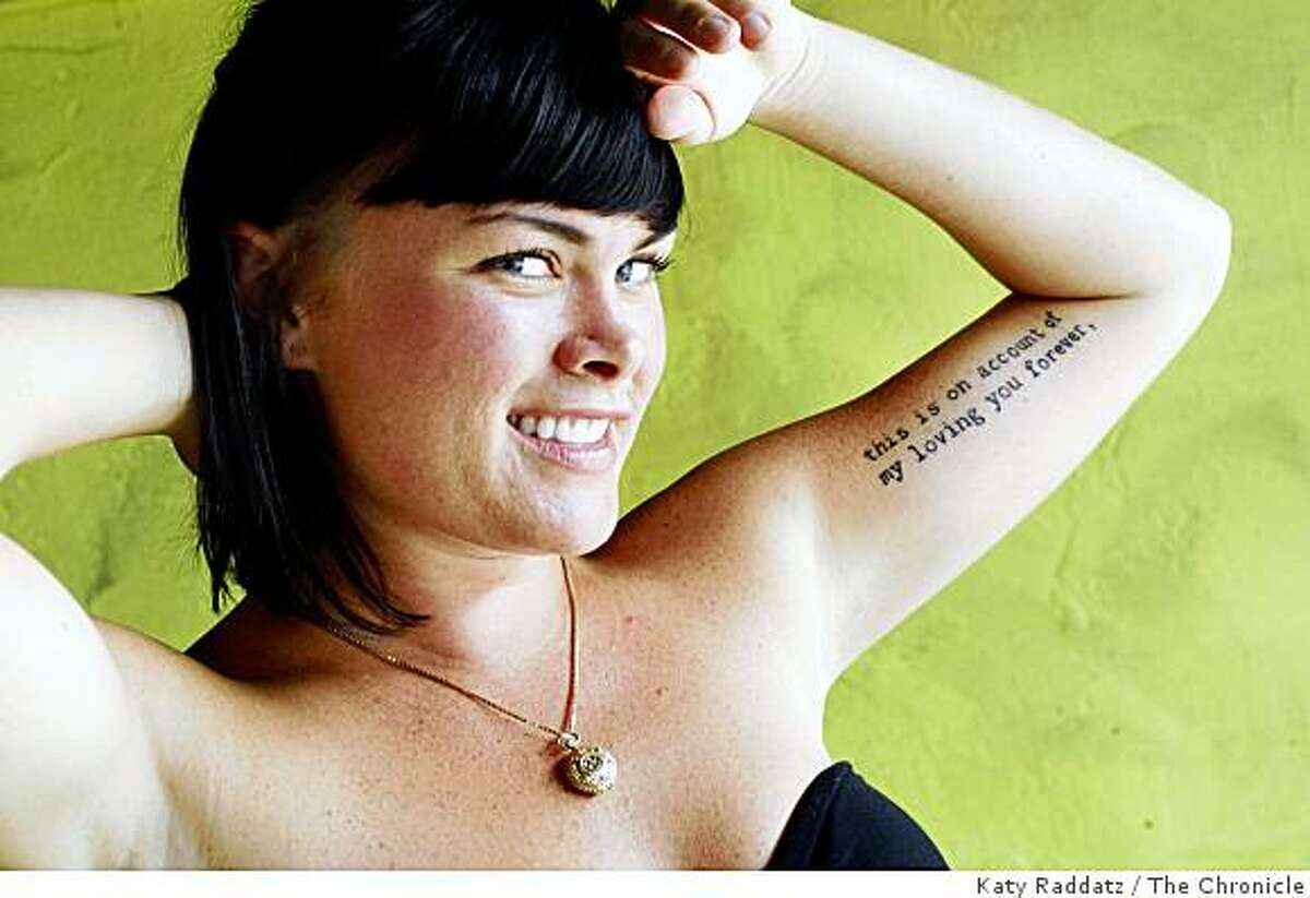 Beth Loster shows the script tattoo on her left arm, which says, "this is on account of my loving you forever," in San Francisco, Calif. on Tuesday, August 19, 2008.