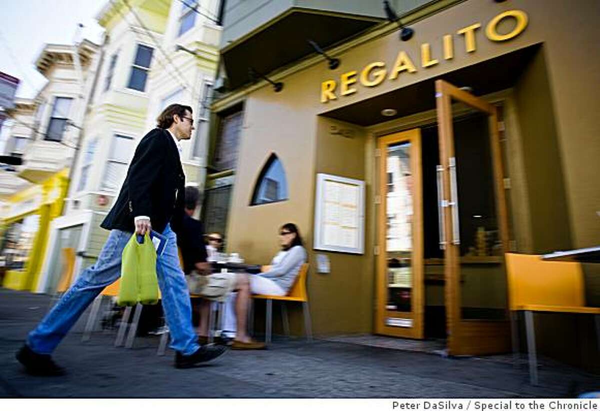 True Sake owner Beau Timkin carries in a couple of Sake's bottles into a Mexican restaurant while on his quest to pair sake with non Japanese food as he visits Regalito Rosticeria in San Francisco, California, Aug. 31, 2008.Photo By: Peter DaSilvaSpecial to the Chronicle