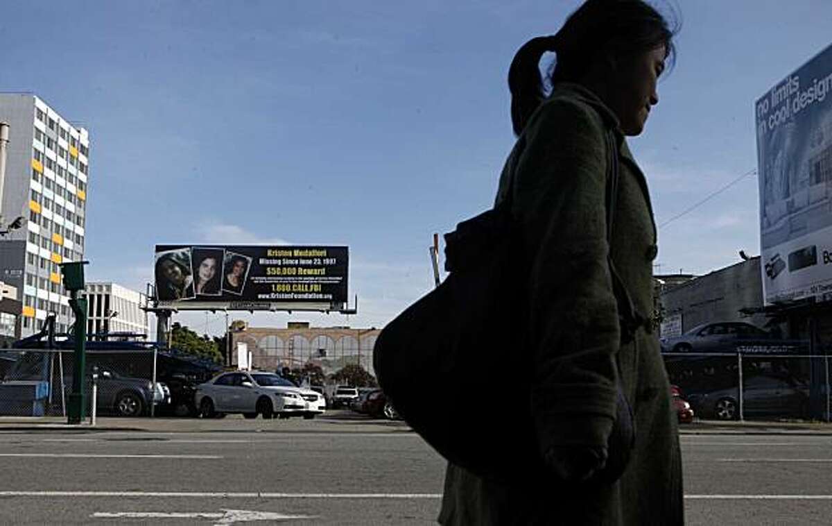 A billboard at 5th and Howard Streets, requesting information about a missing woman named Kristen Modafferi, sits boldly above the street on Thursday Feb. 25, 2010 in San Francisco, Calif. Twelve years ago the 18-year-old college student disappeared and her parents have not given up the search. They recently placed 3 billboard and 5 bus signs around the city offering a reward for her whereabouts.