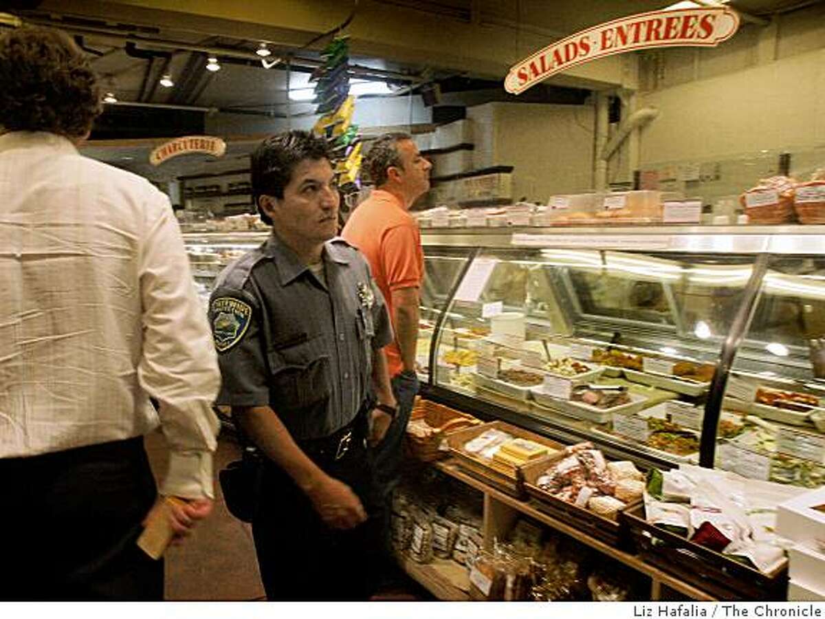 Adan Bernardino has been hired by Market Hall as added security through the deli in the Rockridge area of Oakland, Calif., on Thursday night, August 28, 2008.
