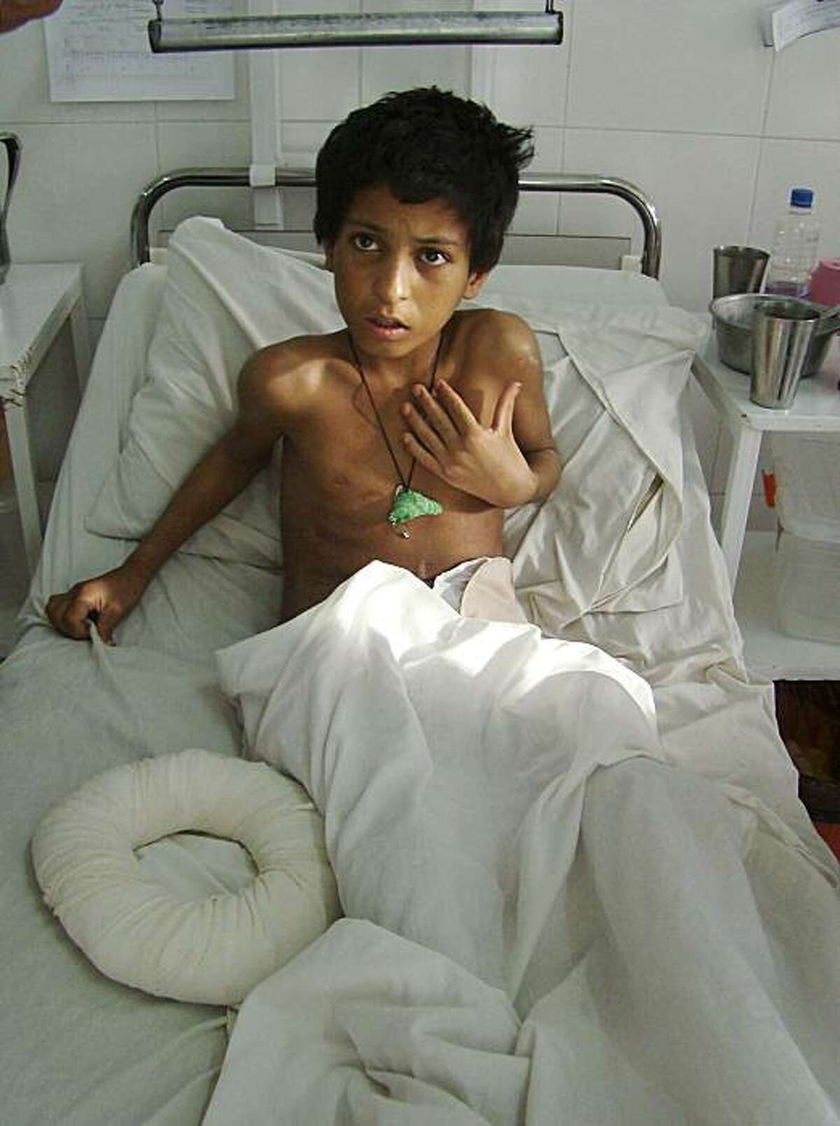 Abdul Hamid, 12, recuperates from his injuries at an Italian charitable hospital in Lashkar Gah, Helmand province, southern Afghanistan, Wednesday, Feb. 24, 2010. At the whitewashed Italian-run Emergency Hospital in Helmand's dusty provincial capital of Lashkar Gah, most of the civilian wounded recuperating from the Marjah battlefield said their injuries were caused by "the foreign soldiers," a claim that could hurt U.S. efforts to win Afghan hearts and minds.
