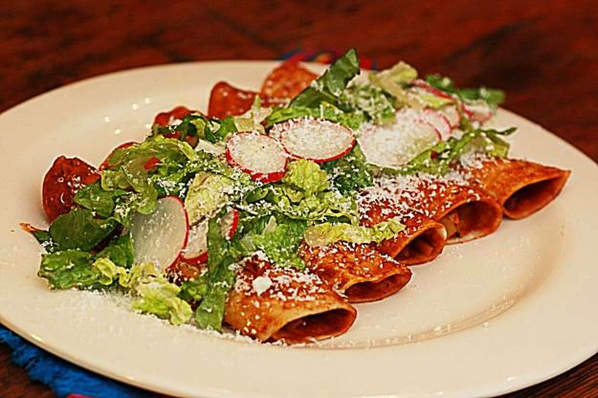 Sweet Enchiladas Under a Salad. For Jacqueline Higuera McMahan South to North column Winter 2010