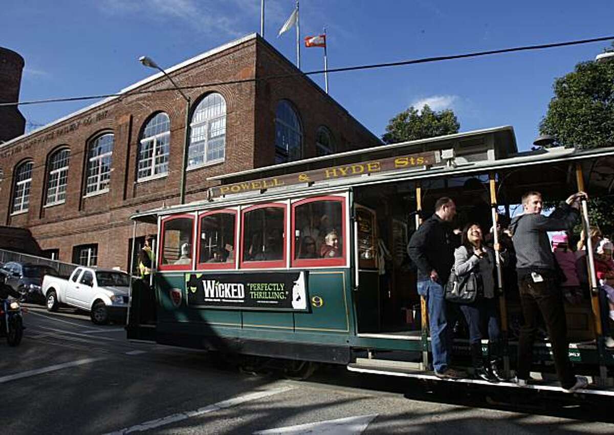 The Cable Car Museum at Washington and Mason streets as a passenger filled trolley passes by in San Francisco, Ca., on Tuesday, February 9, 2010.