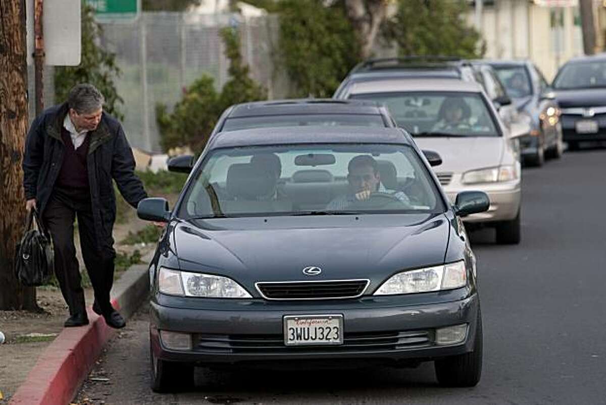Riders get in cars with other commuters at the Casual Carpool pickup point on Thursday February 11, 2010 in El Cerrito, Calif. Photograph by David Paul Morris / Special to the Chronicle