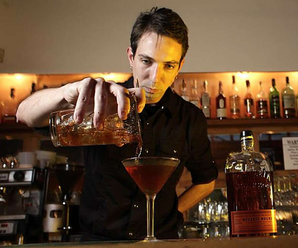 Bartender David Kirk makes a Manhattan, Monday Feb. 8, 2010, at The Townhouse Bar and Restaurant in Emeryville, Calif.