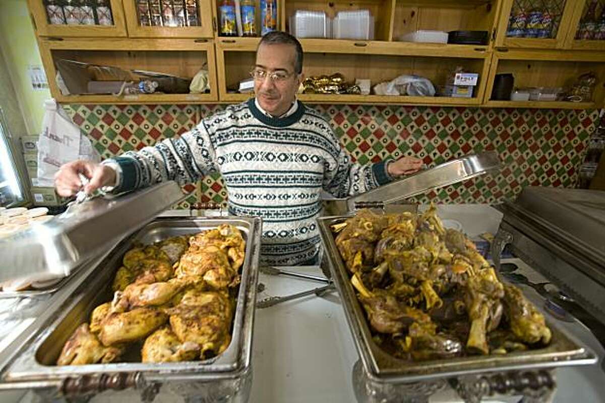 Osman Othman, owner of the newly opened Oasis Market in Oakland, Calif. opens a Lebanese buffet in his store on Friday, Jan. 22, 2009. Oasis Market attracts many Middle Eastern immigrants who live in the local "Koreatown" neighborhood. Oakland gave the Koreatown merchants group $12,000 last year to put up "Oakland's Got Seoul" banners, but when residents noted few actual Koreans live in Koreatown, the group asked for - and got - another $5,000 to take the banners down.