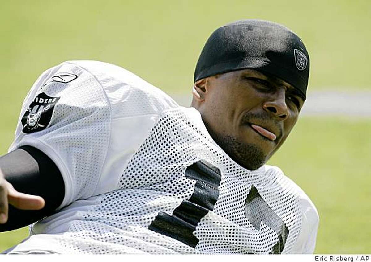 Oakland Raiders wide receiver Javon Walker stretches during workouts at their football training camp in Napa, Calif., Thursday, July 24, 2008.