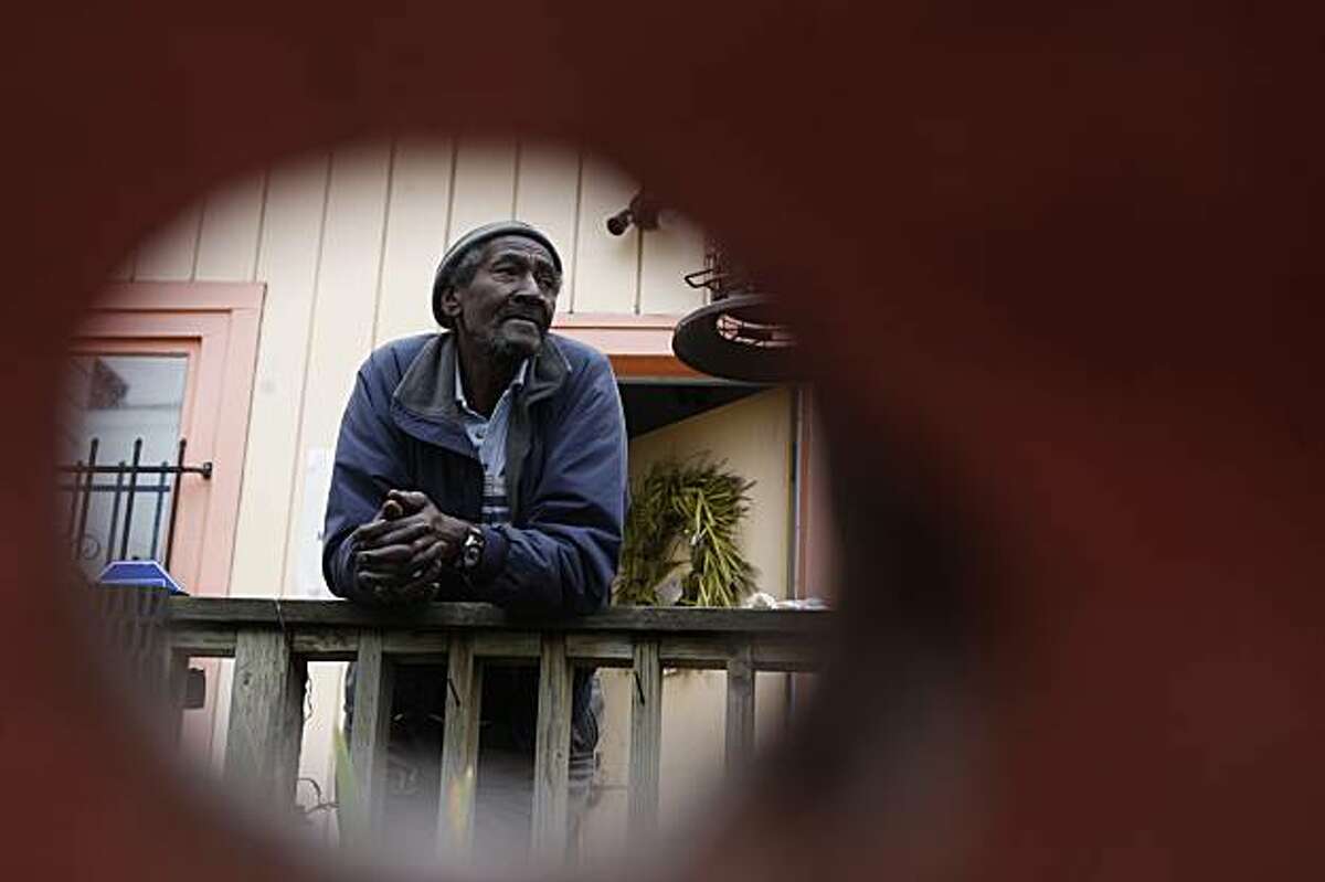 Walter Dukes comments on his house mate Edward Smith at his residence on Maynard St. in San Francisco, Ca., on Monday, January 25, 2010. Smith was shot by a police officer last Saturday on this porch as he was wielding a machete. Duke ponders why Smith used a machete leading to his death.