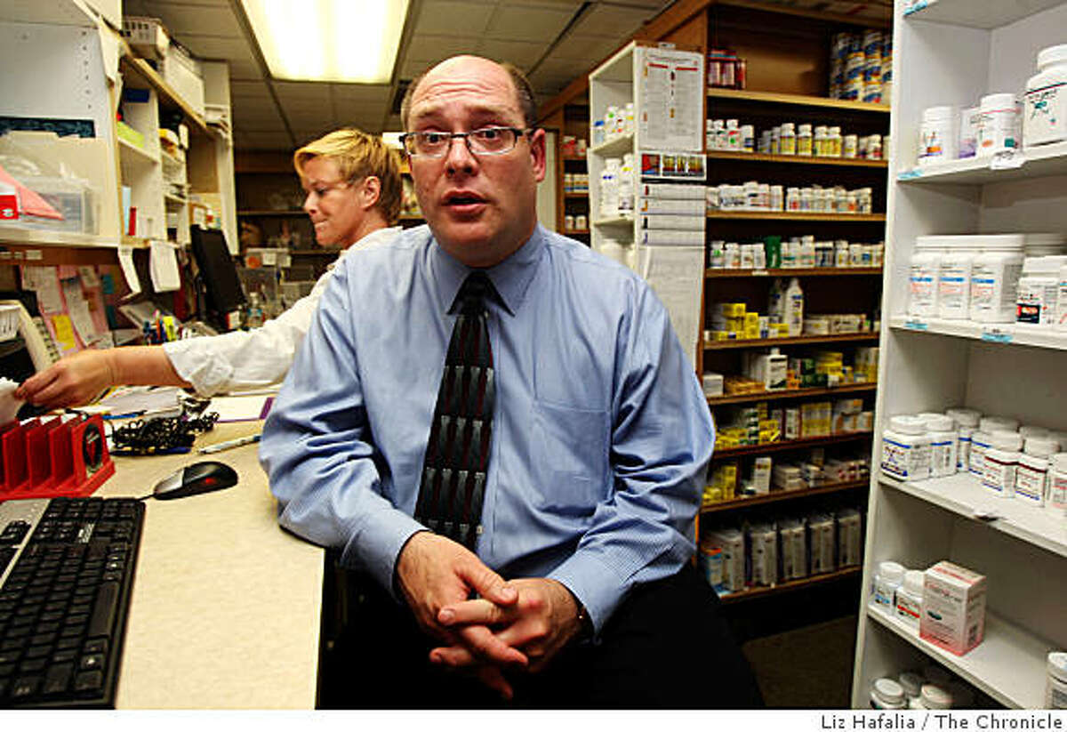 Mickey Lim has been an independent pharmacist in San Francisco, Calif., for 15 years, and has created a special practice devoted to AIDS and HIV patients. With many of his patients on Medi-Cal he's been forced to stop accepting new Medi-Cal patients, and for existing patients will no longer be able to carry some of the critical but expensive medications. At left is colleague pharmacist Paula Johnston who is also devoted to AIDS and HIV patients.Photo by Liz Hafalia/The Chronicle