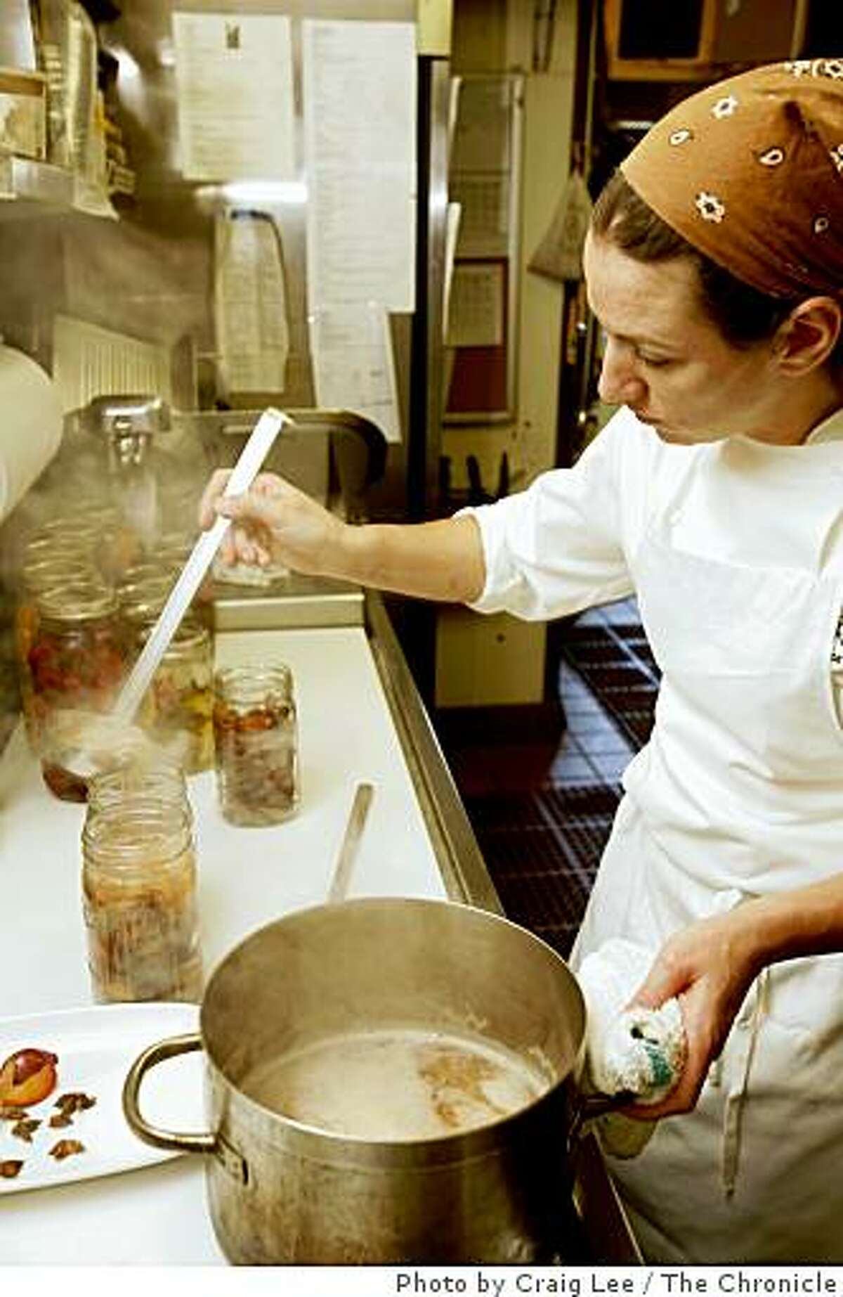 Erica Holland-Toll, chef at The Lark Creek Inn, making Santa Rosa plum pickle in Larkspur, Calif. on July 21, 2008. Erica Holland-Toll pouring the fresh made brine into jars of Santa Rosa plums.Photo by Craig Lee / The Chronicle