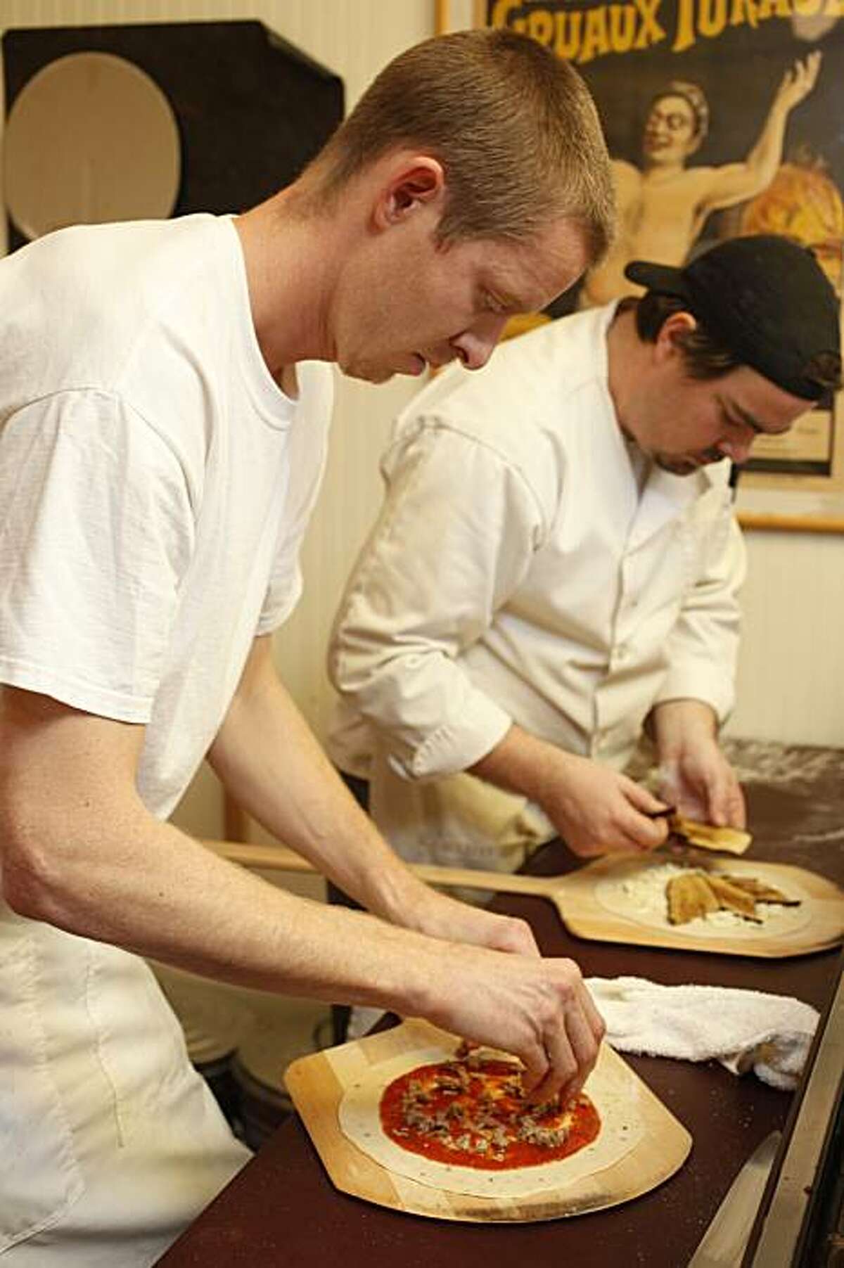 Kyle Rempp (left) and Aaron Welge (right), making pizza at Fort Bragg Bakery, 360 N. Franklin Street in Fort Bragg, Calif., on December 30, 2009.