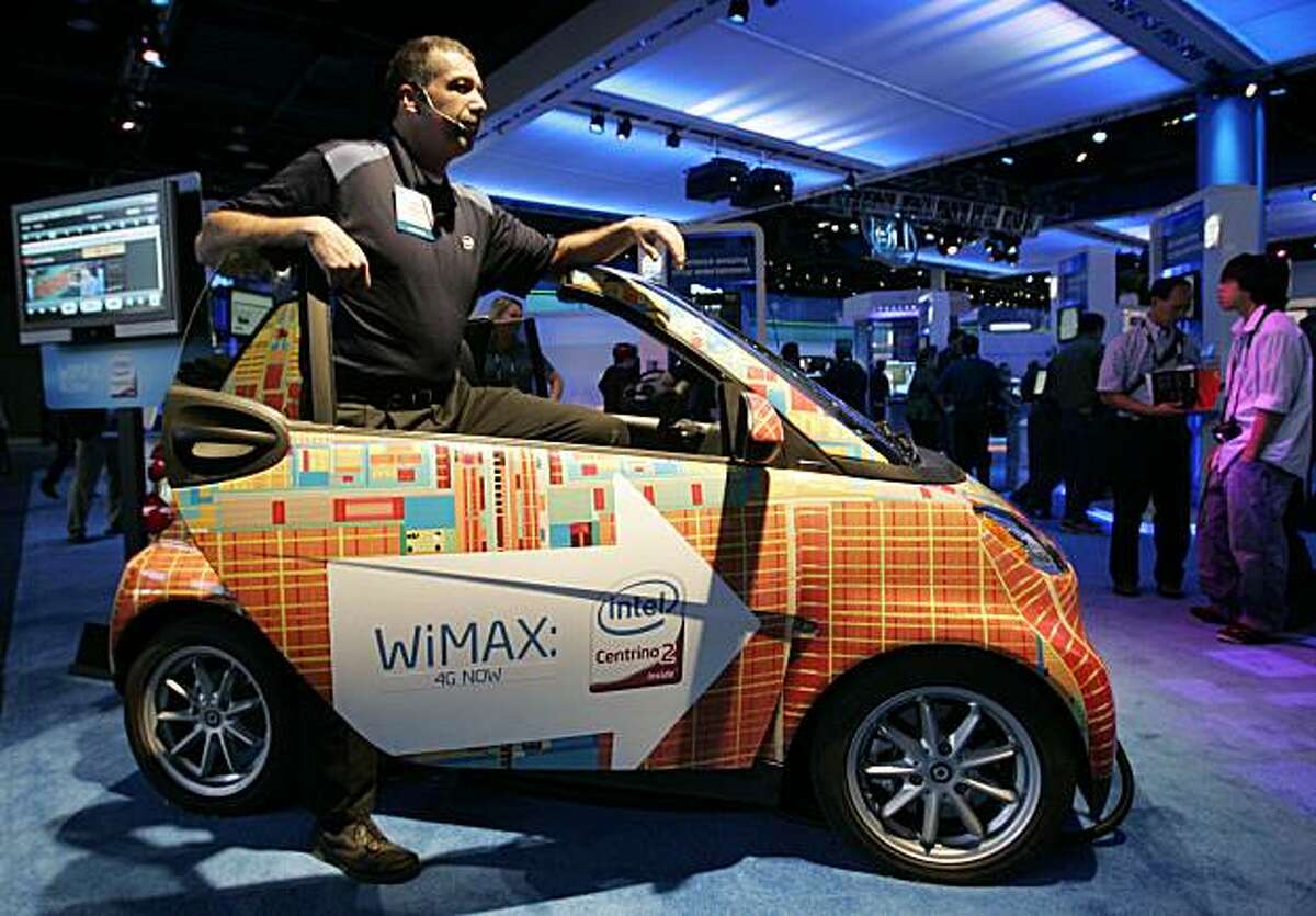 ** ADVANCE FOR USE MONDAY JAN. 4, AND THEREAFTER ** File - In this Jan. 10, 2009 file photo, an Intel WiMax Smart Car is shown on display in the Intel Booth at the International Consumer Electronics Show (CES) in Las Vegas.(AP Photo/Paul Sakuma, file)