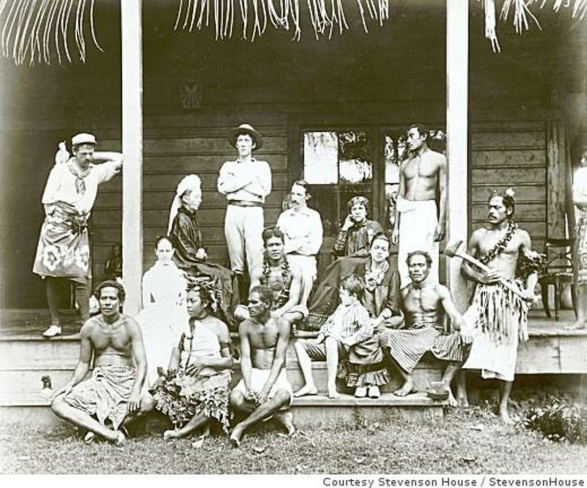 Mr. and Mrs. Robert Louis Stevenson (seated center) with family and servants at their home in Samoa.