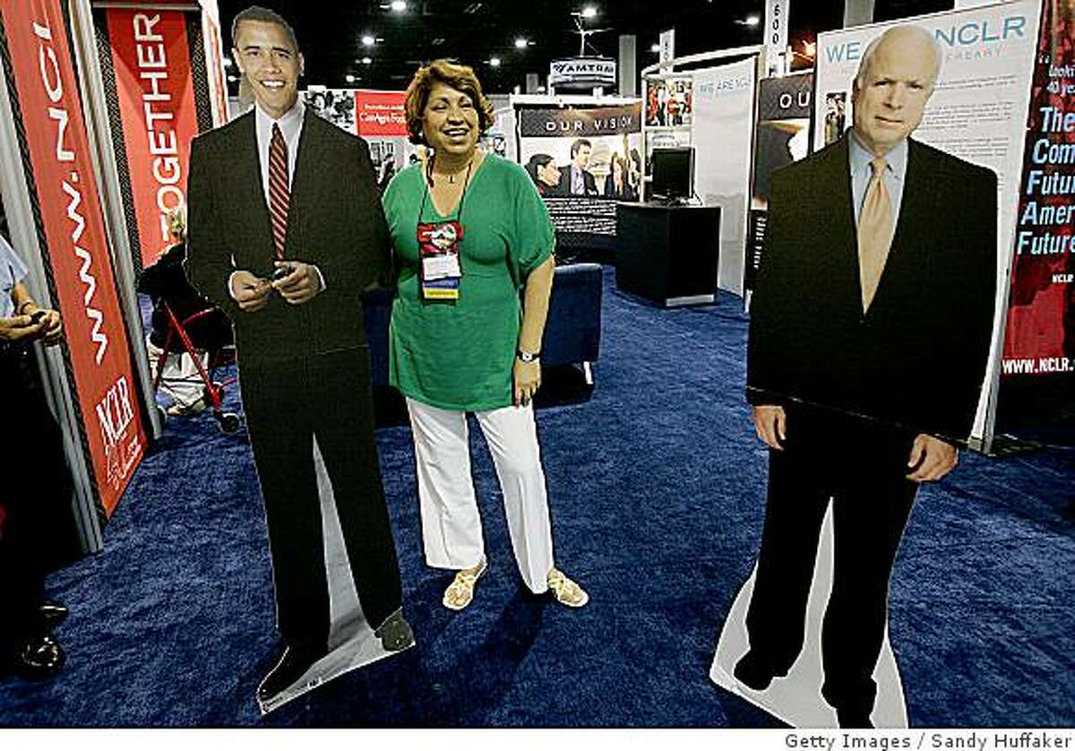 SAN DIEGO, CA - JULY 13: Maria Garcia has her portrait taken with a cut-out image of Presumptive Demcoratic presidential nominee Barack Obama at the National Council of La Raza Annual Meeting on July 13, 2008 in San Diego, California. The NCLR is the largest Hispanic Civil rights and advocacy organization in the United States and works to opportunities for Hispanic Americans.(Photo by Sandy Huffaker/Getty Images)