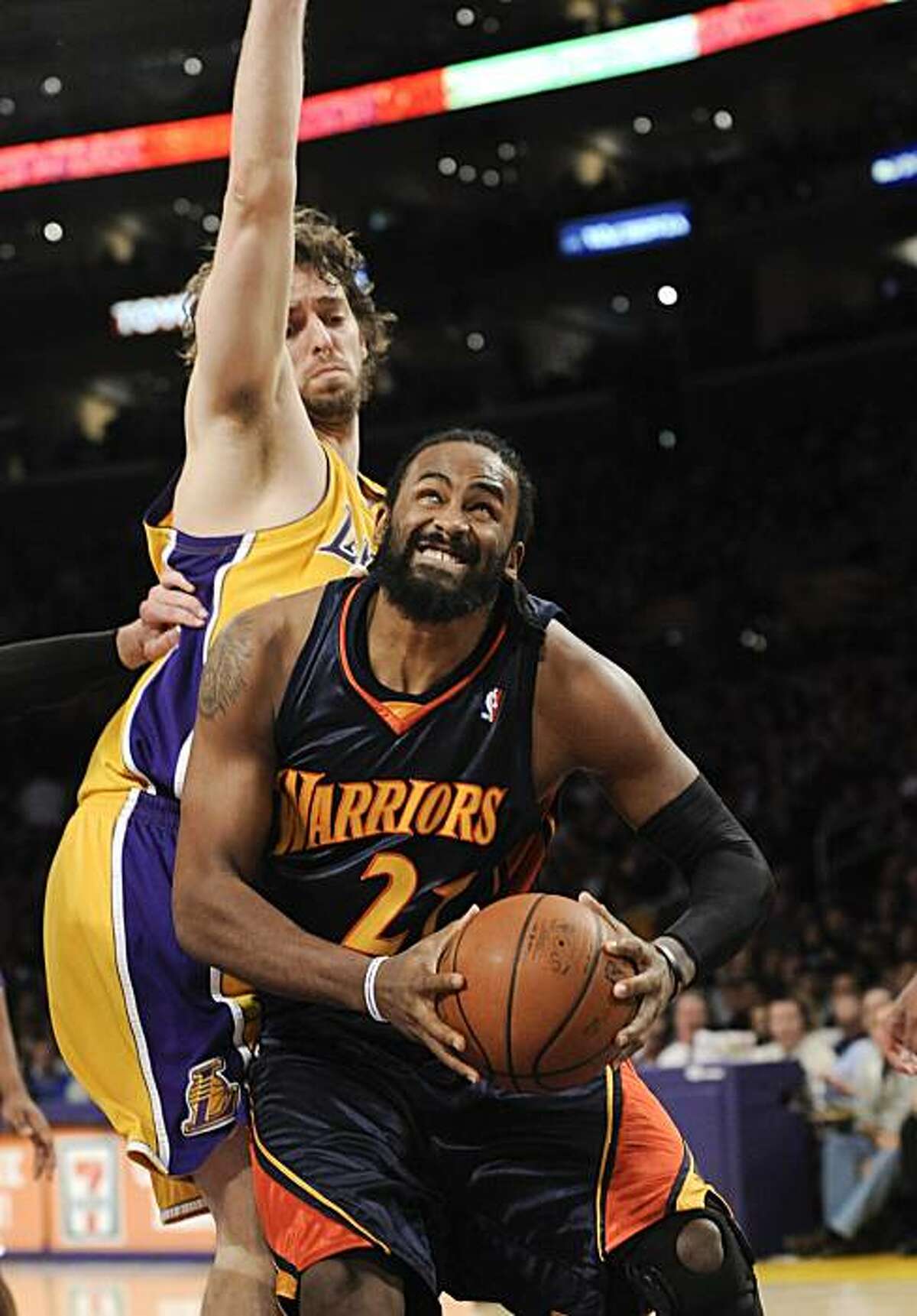 Golden State Warriors center Ronny Turiaf attempts to get position on Los Angeles Lakers center Pau Gasol in the first half Tuesday in Los Angeles.