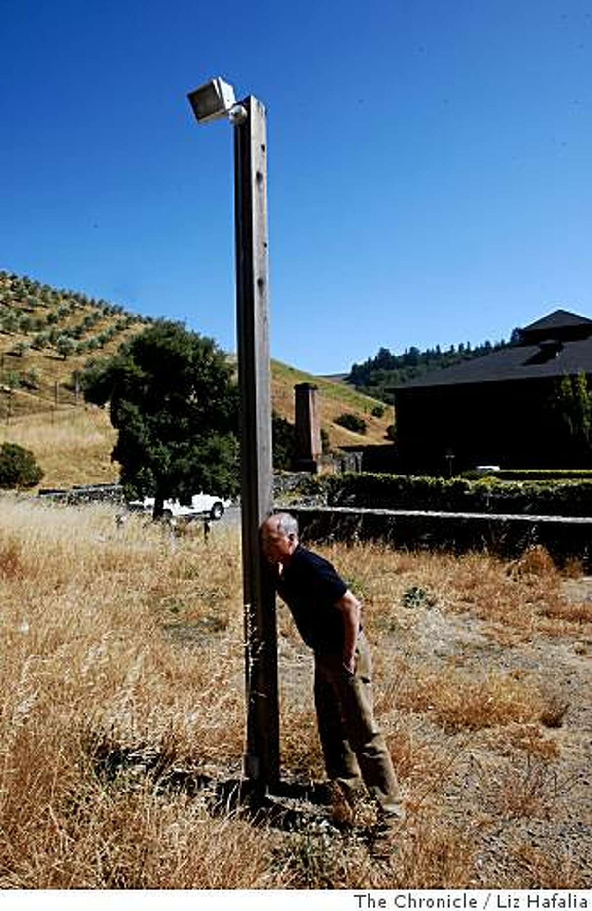 Sound designer Ben Burtt listens to find out if he can hear the buzzing from a parking lot lamp post he recorded at Skywalker Ranch in Marin on June 16, 2008. He used the sound for the skull characters in the new "Indiana Jones" movie. 