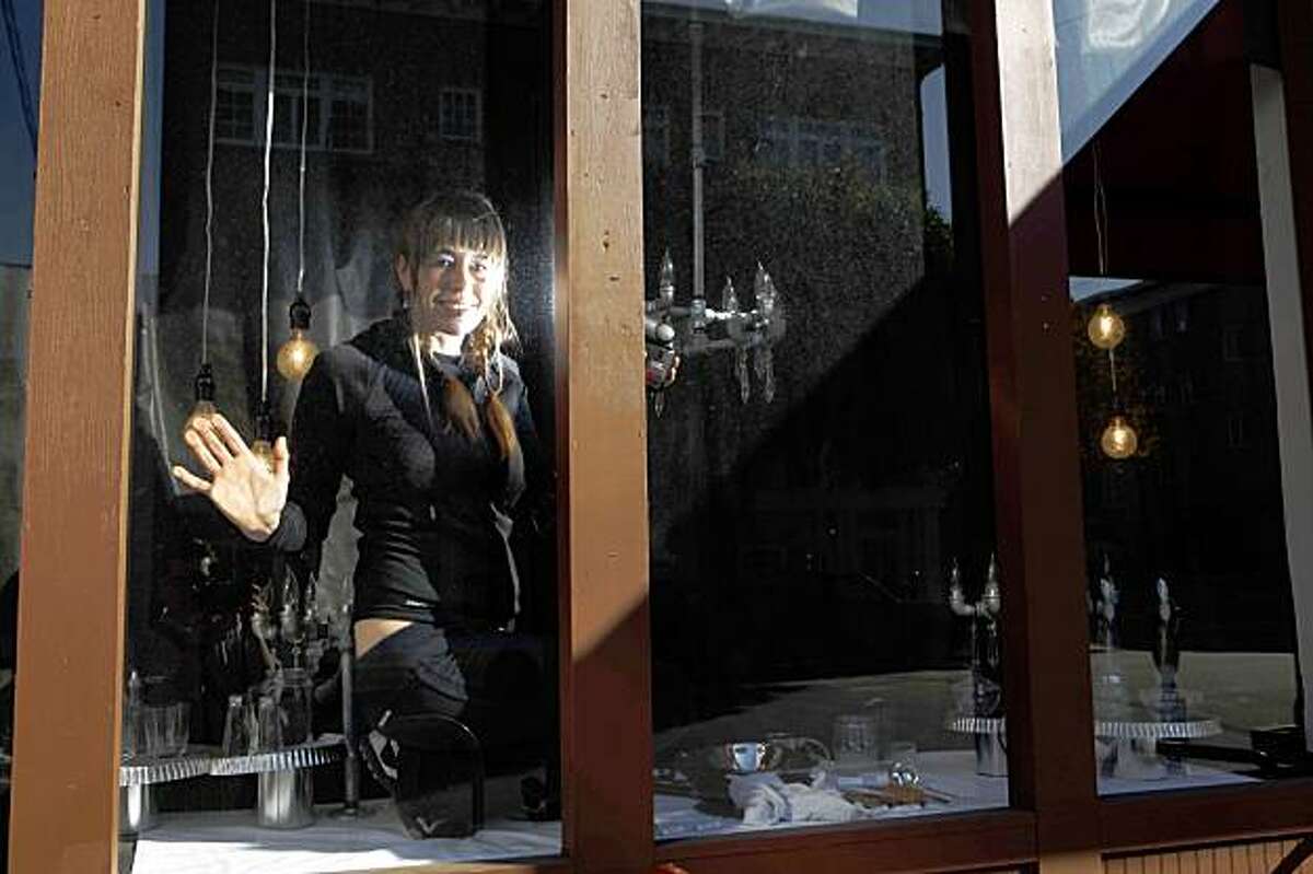 Noelle Nicks, Visual Merchandise Manager and curator of all things hardware at Cole Fox Hardware Stores, stands for a portrait in one of her window displays a the store on Cole Street on Monday Nov. 16, 2009 in San Francisco Calif.