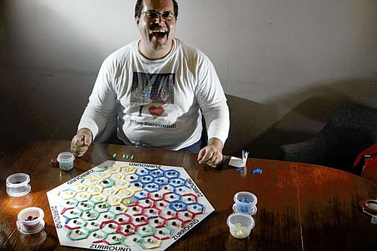 Game designer Evan Koch sits for a portrait with his newest creation called Zurround on Tuesday Sept. 1, 2009 in San Francisco, Calif.