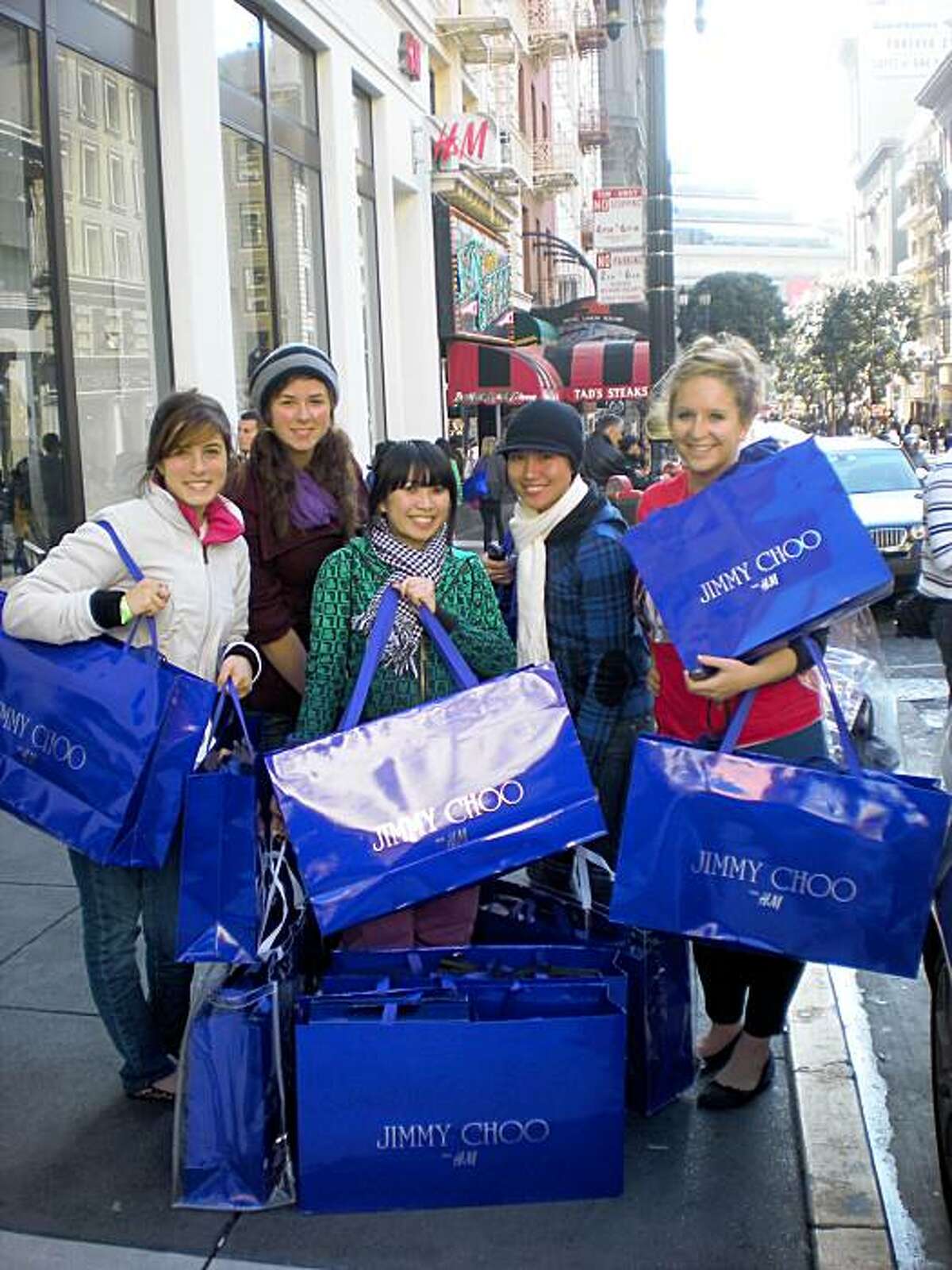 A group of USF students, a.k.a. the "Fab five": Alia Al-Sharif, 21; Alex Platt, 21; Holly Luong, 23; Nghi Lu, 23; and Jo Wiencek, 21. They spent $4,500 altogether on H&M's Jimmy Choo collection, which went on sale Nov. 14 at the Powell Street store.
