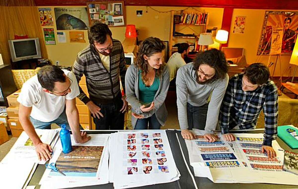 Jesse Nathan, ( left) Jordan Bass, Michelle Quint, Brian McMullen, and Christopher Benz look over the proofs of the new publication published by McSweeneys and independent house, Thursday Nov. 5, 2009, in San Francisco, Calif.