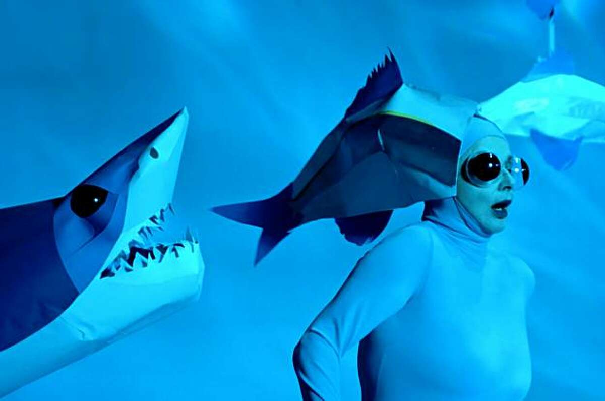 Isabella Rossellini, dressed as an anchovy, runs from a shark in Green Porno, her series of short films and book about the mating habits of marine mammals and insects.