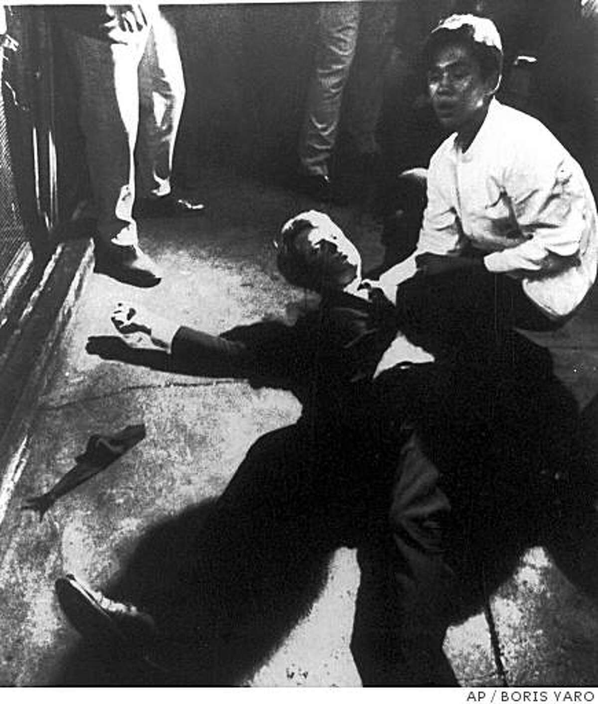 ** FILE ** Sen. Robert Kennedy awaits medical assistance as he lies on the floor of the Ambassador Hotel in this file photo taken June 5, 1968, in Los Angeles moments after he was shot. If all goes as planned, carefully crated pieces of the room where Kennedy was assassinated will be stored on a garbage-strewn lot with a view of graffiti-covered buildings and a strip club billboard. (AP Photo/Los Angeles Times, Boris Yaro, File)