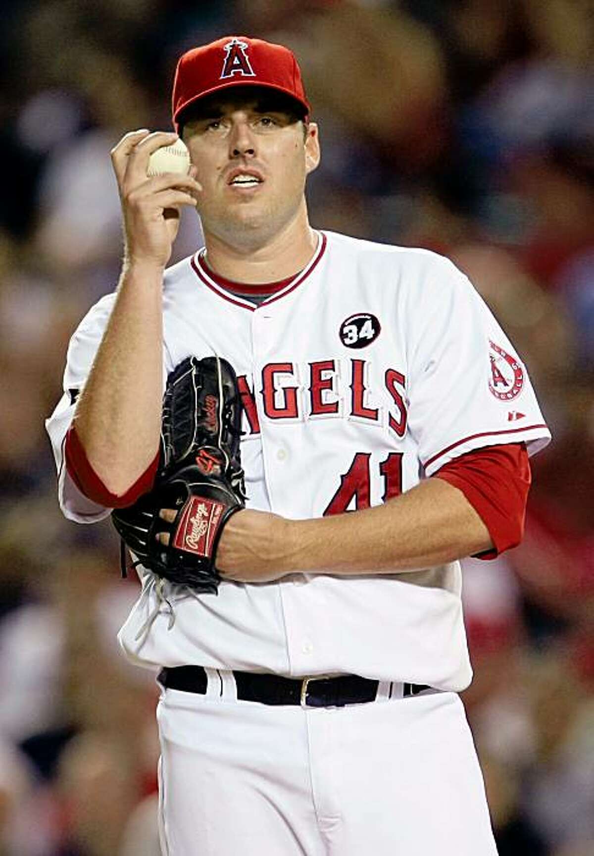 ANAHEIM, CA - OCTOBER 22: John Lackey #41 of the Los Angeles Angels of Anaheim reacts in Game Five of the ALCS against the New York Yankees during the 2009 MLB Playoffs at Angel Stadium on October 22, 2009 in Anaheim, California. (Photo by Stephen Dunn/Getty Images)