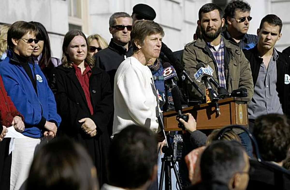 Mary Bonauto of Gay & Lesbian Advocates & Defenders, center, addresses supporters of same-sex marriage on the steps of City Hall, in Portland, Maine, on Wednesday, Nov. 4, 2009, a day after voters rejected the gay marriage law. (AP Photo/Pat Wellenbach)