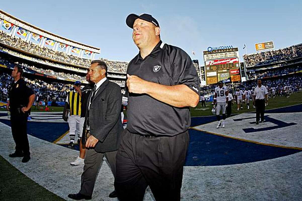 Oakland Raiders head coach Tom Cable leaves the field after his team lost to the San Diego Chargers 24-16 in an NFL football game Sunday, Nov. 1, 2009 in San Diego. (AP Photo/Chris Park)