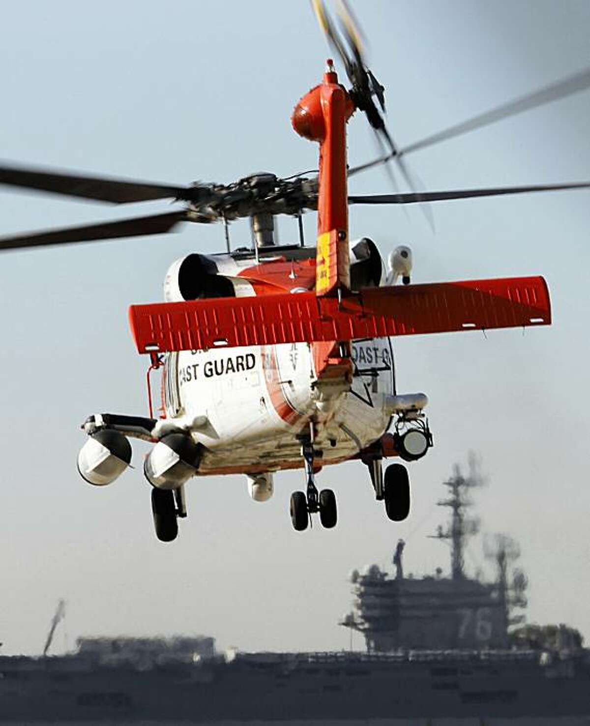 FILE -- A U.S. Coast Guard MH-60 Jayhawk helicopter lifts off at the San Diego Coast Guard Station during a search effort Friday, Oct. 30, 2009, in San Diego.