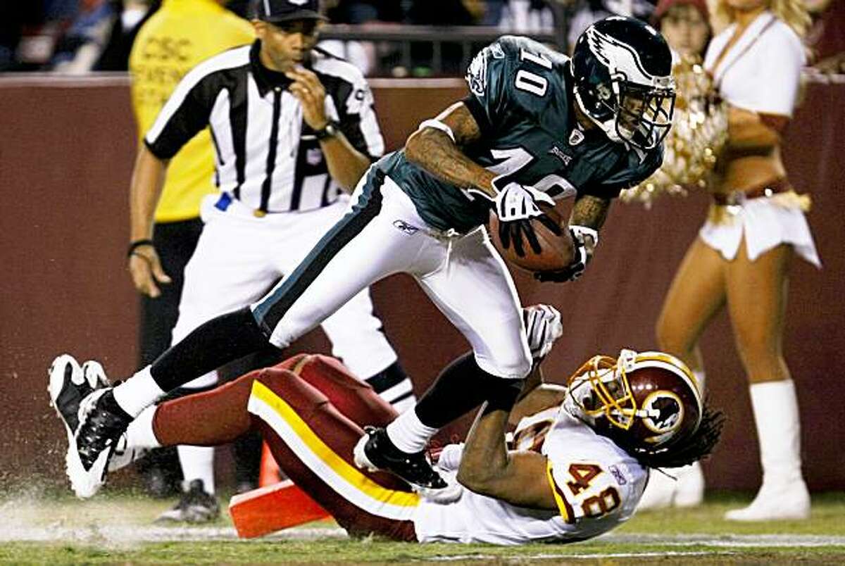 LANDOVER, MD - OCTOBER 26: DeSean Jackson #10 of the Philadelphia Eagles trips over Chris Horton #48 of the Washington Redskins to score a touchdown in the second quarter of the game at FedEx Field October 26, 2009 in Landover, Maryland. (Photo by Win McNamee/Getty Images)