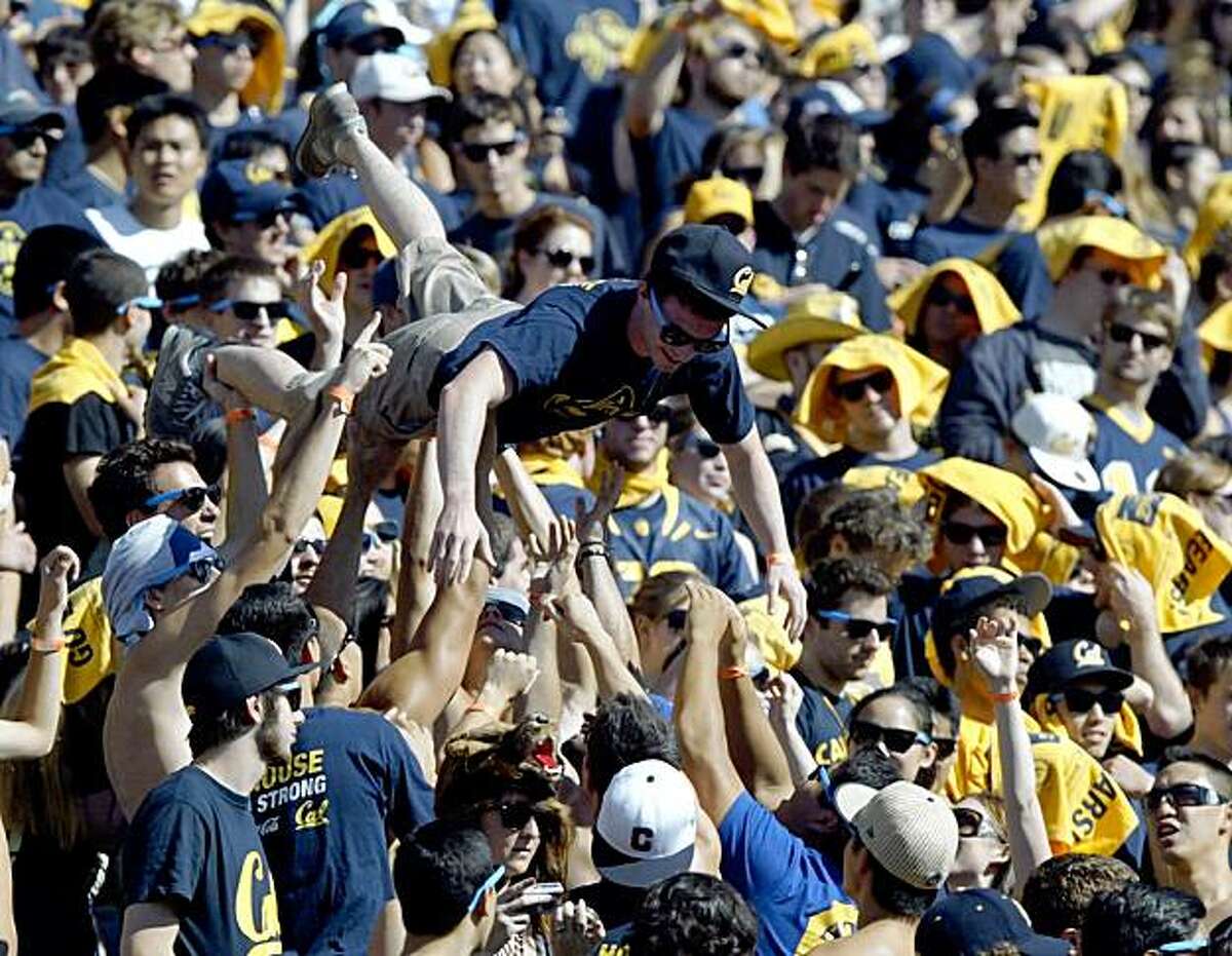 A California Golden Bears' fan crowd surfs during the first quarter of their game NCAA college football game against the Washington State Cougars at Memorial Stadium, in Berkeley, Calif., on Saturday, Oct. 24, 2009. (AP Photo/Bay Area New Group, Anda Chu) ** LOCALS PLEASE CREDIT/MAGS OUT **