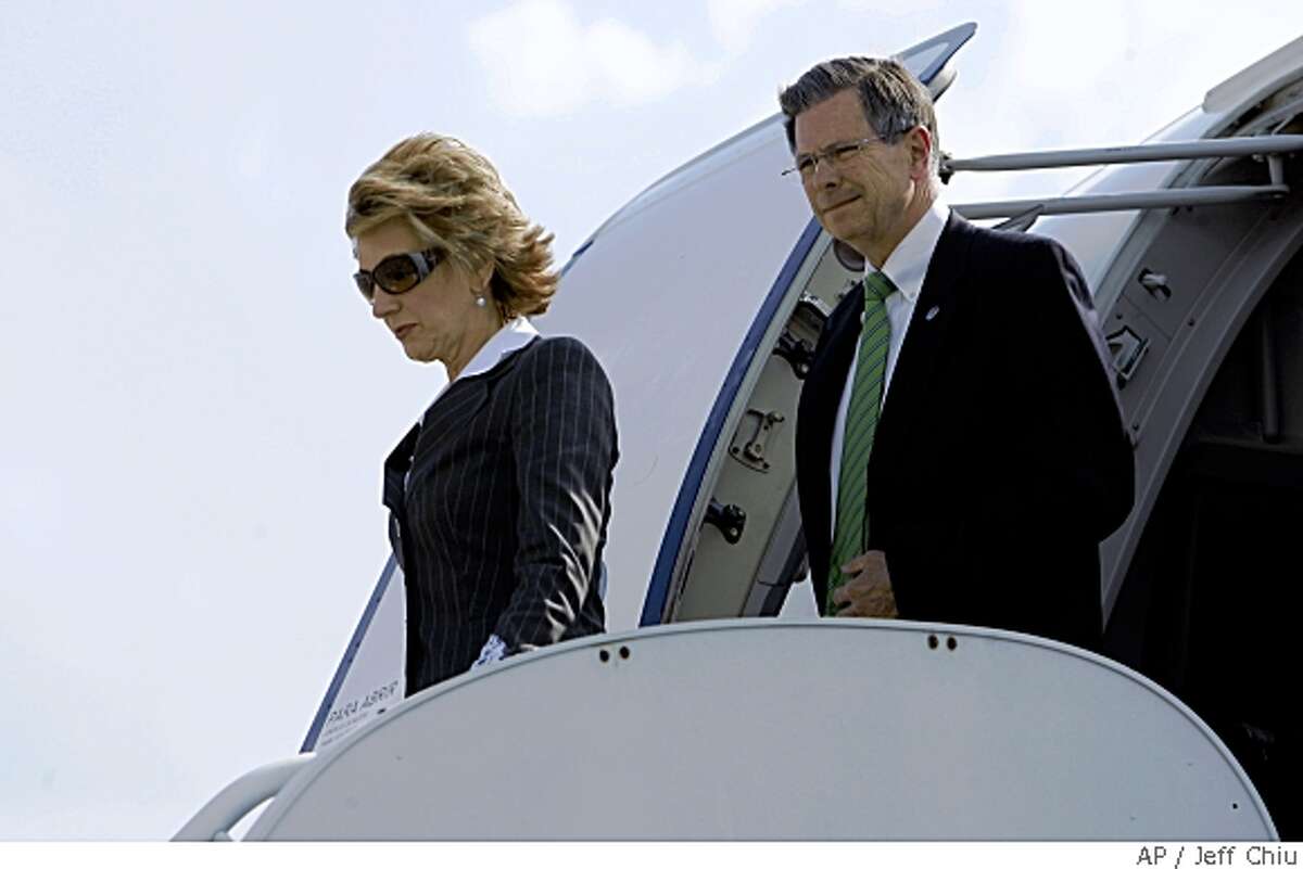 Carly Fiorina, left, and Charlie Black, advisers to Republican presidential candidate, Sen. John McCain, R-Ariz., walk off McCain's chartered plane Monday, May 19, 2008, in Savannah, Ga. (AP Photo/Jeff Chiu)