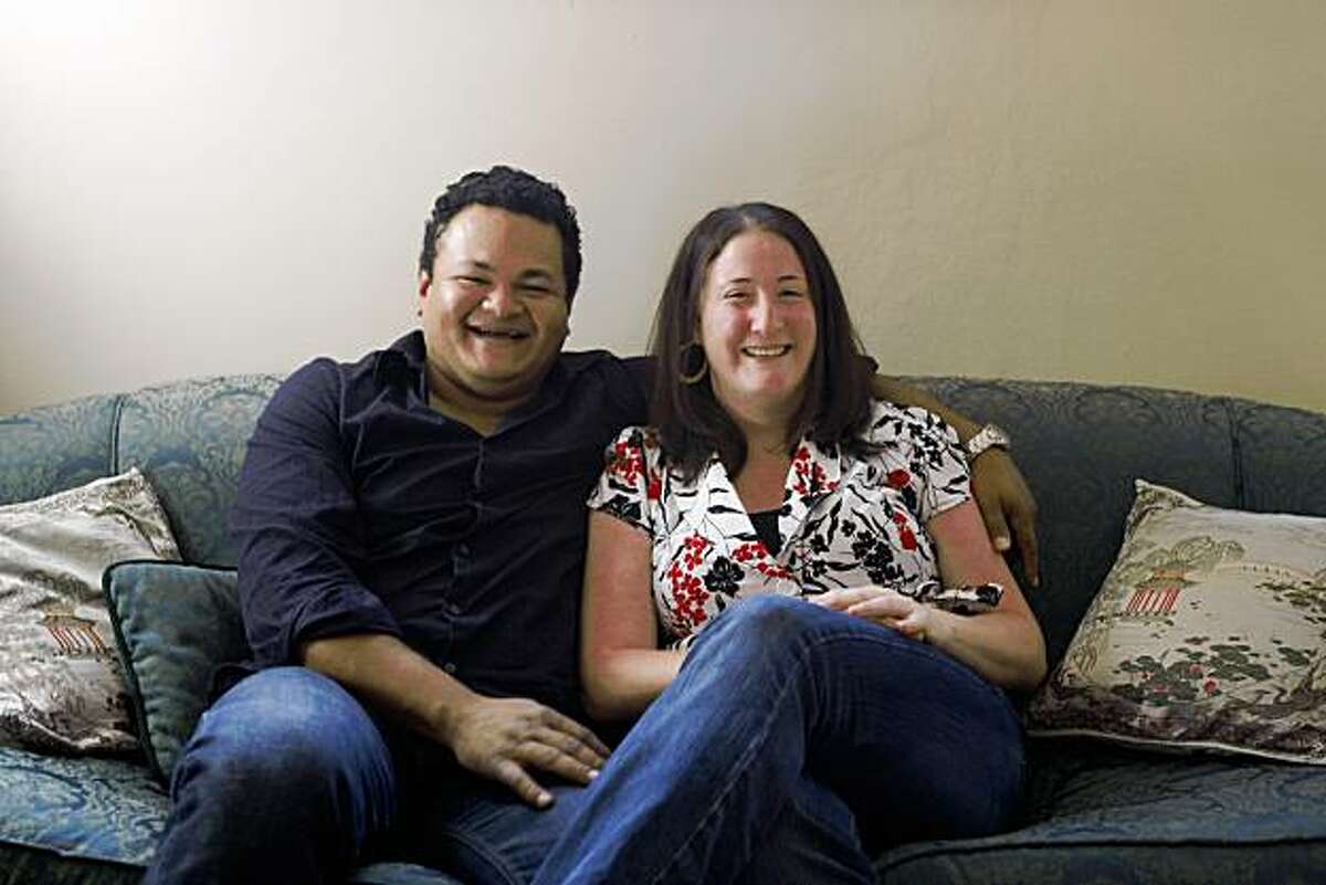 Jenn Meyers (right) and Francisco Guerrero fall in love and now are "on the couch" for a portrait in there home in Oakland, Calif., on October 3, 2009.