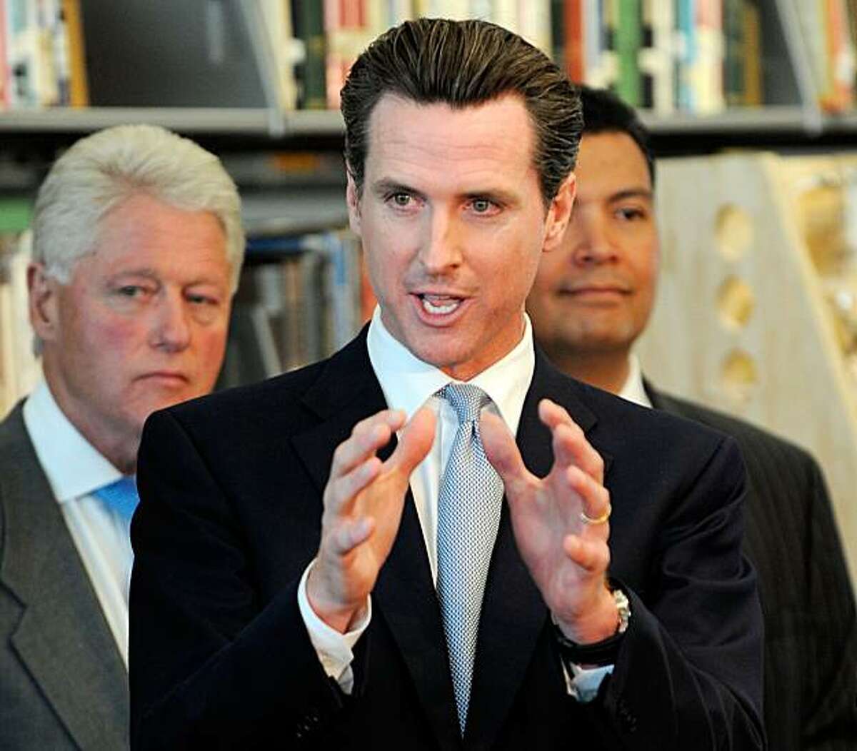 LOS ANGELES, CA - OCTOBER 05: California gubernatorial candidate San Francisco Mayor Gavin Newsom speaks as former President Bill Clinton looks on during a discussion with students and faculty of Los Angeles City College about education for green technology jobs on October 5, 2009 in Los Angeles, California. Clinton was in Los Angeles to help raise funds for Newsom's campaign for California governor. (Photo by Kevork Djansezian/Getty Images)