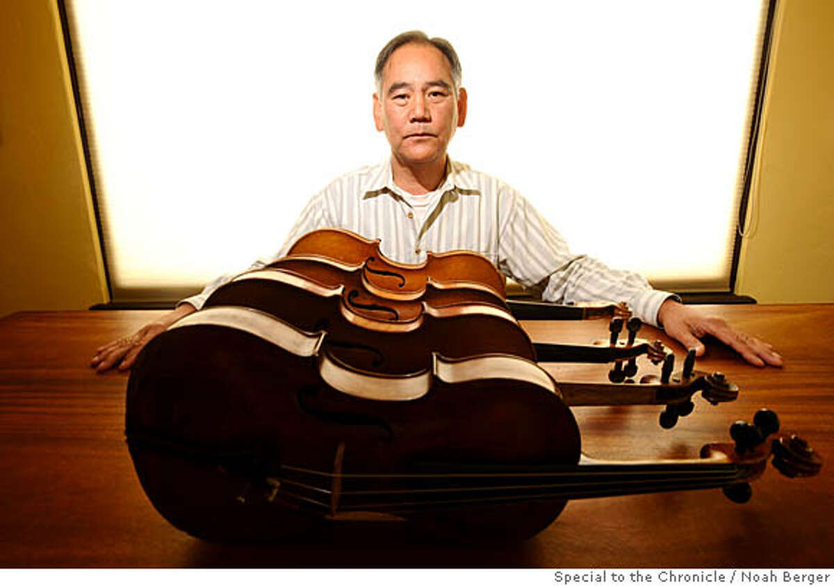 Bob Ng displays four violins he acquired from Joseph Hokai Tang in his Berkeley, Calif., home on Friday, May 9, 2008. Photo by Noah Berger / Special to the Chronicle Ran on: 05-12-2008 Bob Ng, a stringed-instrument collector and amateur cello player, displays four violins he acquired from Joseph Hokai Tang. Ran on: 05-12-2008 Bob Ng, a stringed-instrument collector and amateur cello player, displays four violins he acquired from Joseph Hokai Tang. Ran on: 05-12-2008 Ran on: 05-12-2008 Bob Ng, a stringed-instrument collector and amateur cellist, displays four low-quality violins he acquired from Joseph Hokai Tang.