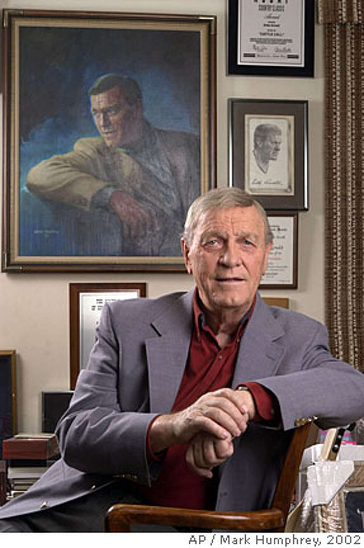 ** In this Jan. 18, 2002 file photo, country music legend Eddy Arnold is shown in his memorabilia-filled office in Brentwood, Tenn. Arnold died at a care facility near Nashville Thursday morning May 8, 2008. He was 89. (AP Photo/Mark Humphrey,File)