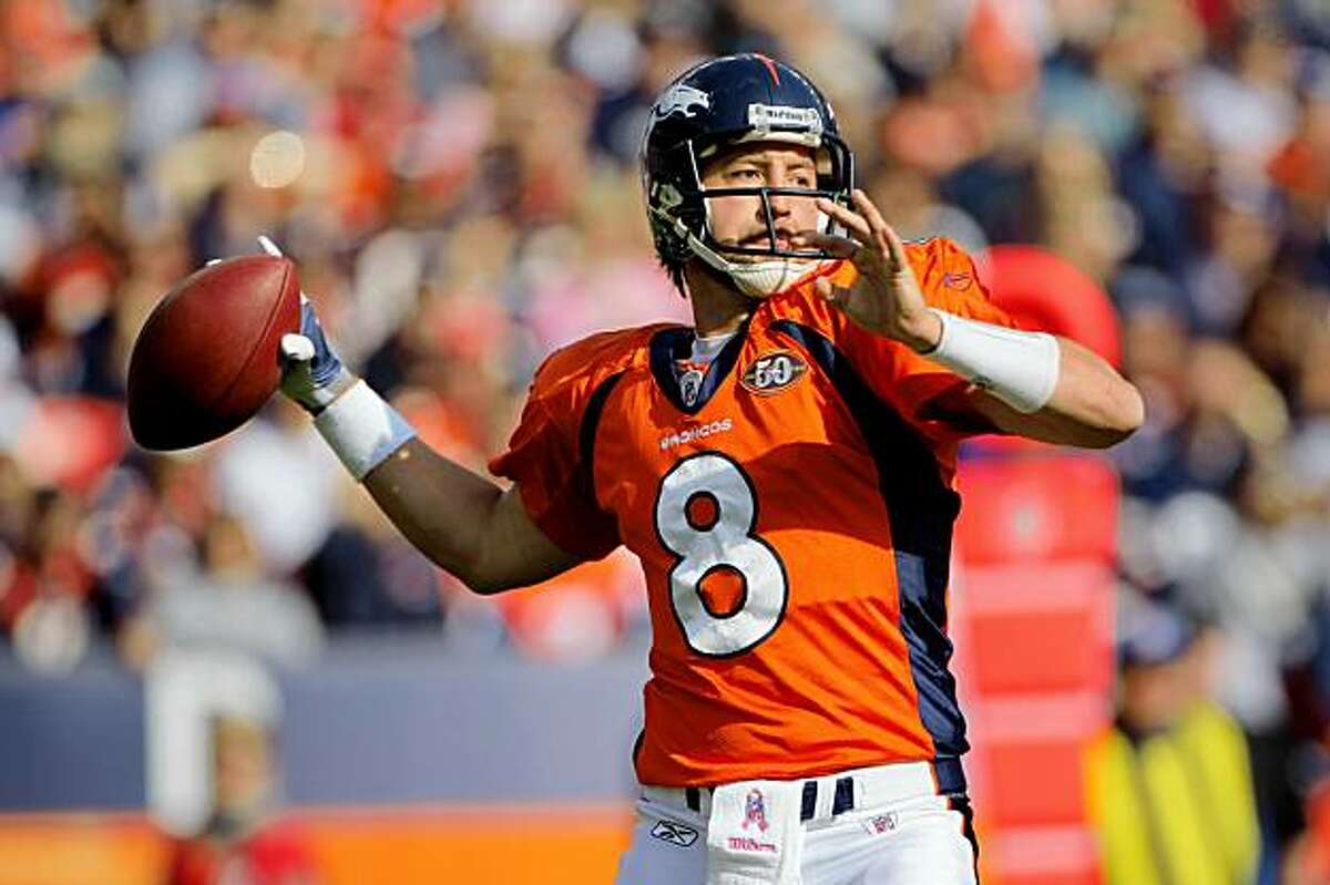 Denver Broncos cornerback Champ Bailey knocks down a fourth down and two at  the two pass to Dallas Cowboys wide receiver Sam Hurd at Invesco Field at  Mile High in Denver on