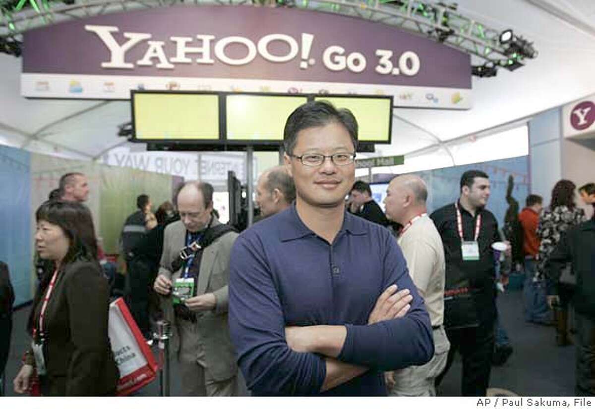 ###Live Caption:** FILE ** Yahoo CEO Jerry Yang poses for a photo in front of the Yahoo booth at the Consumer Electronics Show in Las Vegas in this Jan. 7, 2008 file photo. Tech-industry history shows that the failure of Microsoft and Yahoo to come together on an acquisition could turn out to be brilliant. (AP Photo/Paul Sakuma, file)###Caption History:** FILE ** Yahoo CEO Jerry Yang poses for a photo in front of the Yahoo booth at the Consumer Electronics Show in Las Vegas in this Jan. 7, 2008 file photo. Tech-industry history shows that the failure of Microsoft and Yahoo to come together on an acquisition could turn out to be brilliant. (AP Photo/Paul Sakuma, file)###Notes:###Special Instructions:JAN 7, 2008 FILE PHOTO.